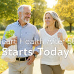 Happy couple in their 50s walking in park promoting heart health after 50